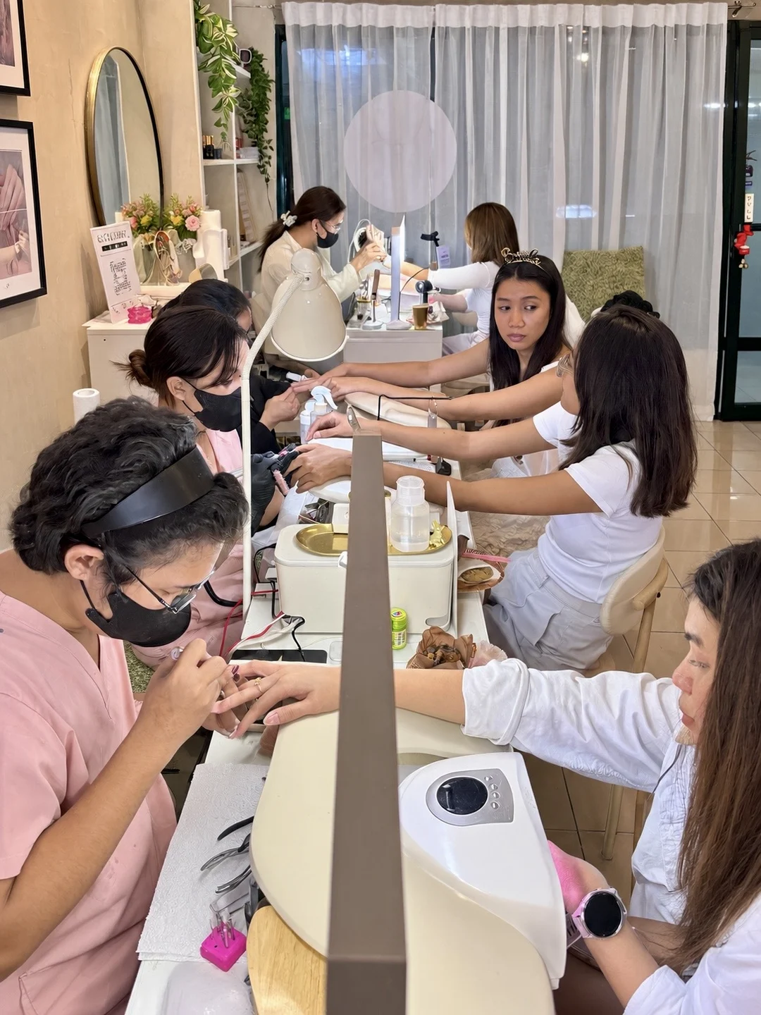 Bridal party getting manicures together during a bridal shower at AyuriNails Beauty Lounge, Poblacion Makati